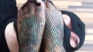 Blonde tattooed lady and her foot slave