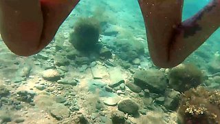 Big breasted MILF seductress posing naked underwater