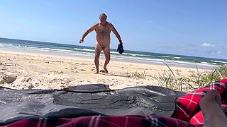 Fat wife blows on the beach