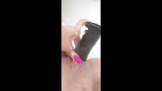MILF Plays in the Tub with a Big Dildo