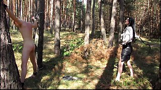 Outdoor whipping in forest by hot german mistress
