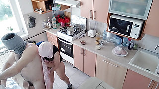 A hot amateur couple having fun in the kitchen.