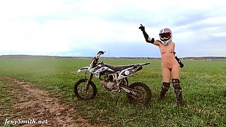 Naked woman riding a Dirt Bike