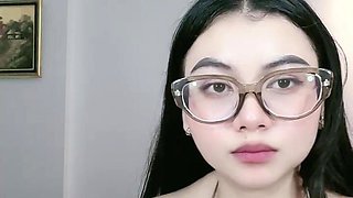 Beautiful Asian Woman Shows Off Cleavage