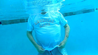 Couple Underwater Diving and Swimming