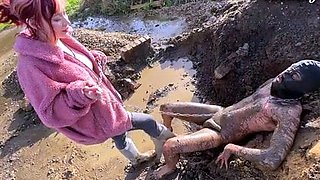 Extreme ballbusting in the mud Miss Eva Ray
