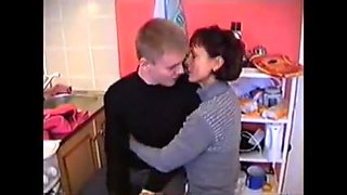 Russian mom Amalia with her boy in kitchen
