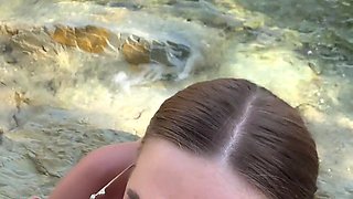 Buxom whore gives stranger blowjob and handjob on the beach