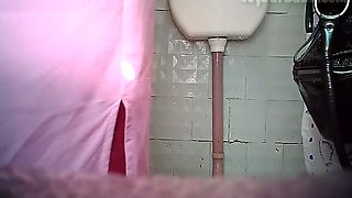 Chunky mature white woman in the toilet room filmed from front
