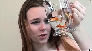 Pretty hungry girl swallows innocent fish - Vore