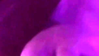 Young Girl Using Her Feet to Play with the Dildo While Masturbating
