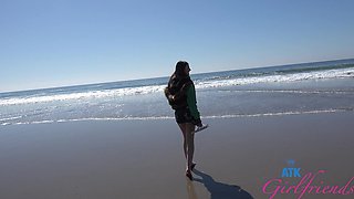 A girl was having fun on the beach with her friend.