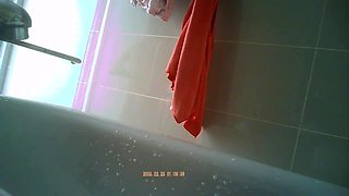 Innocent asian spy in a bathroom