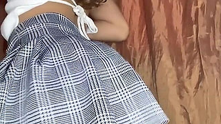 Innocent Girl with a Tender Face Masturbates Her Pussy in a Miniskirt