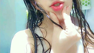 Naughty girl taking a hot shower and getting horny ending up masturbation at shower , mouth close up