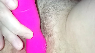 My wife lies and plays with her pussy with a dildo until she has an orgasm