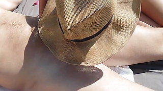 Stepdaughter touches her stepfather's cock and blows her on a nudist beach