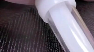 Fat cow has teats hooked up to milking machine