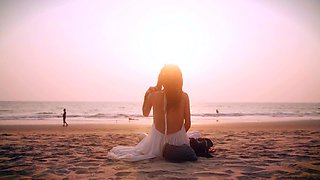 Hot teen stripping seductively and posing naked on the beach