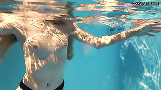 Perfect body blonde teen enjoys naked swimming