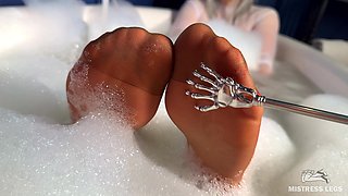Scratching Mistress's Nylon Feet with a Scratcher in a Foam Bath