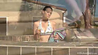 Hairy girl Veronica Snow goes swimming in her pool - WeAreHairy