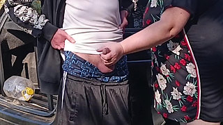 A neighbor holds my dick while I pee and then sucks it in public