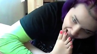 Goth emo girl licks her own feet