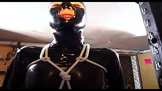 Masked Slave in Latex and BDSM Gear Plays with Sex Toys and Gets Spanked