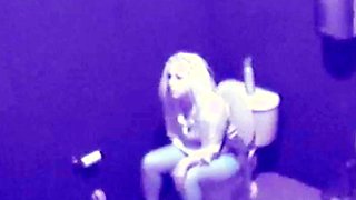 Sexy blonde on a toilet