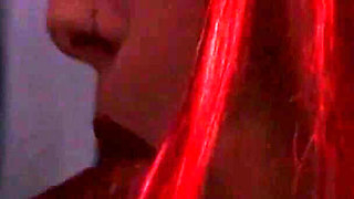 Redhead nurse sucks cock at a gloryhole