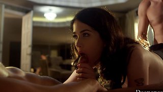 Two guys share a hot brunette's pussy in an intense threesome scene.