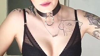 Tattooed gothic lady smoking in the kitchen