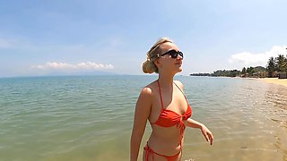 Lovita Fate is a naughty angel in sexy micro bikini on the beach