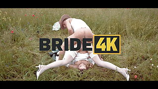 BRIDE4K. Pretty brunette bride fucks a horny shepherd in a summer field