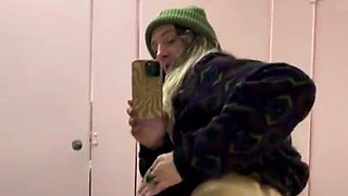 Sensuous teen films herself stripping in public toilet