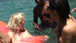A massive blowbang swimming pool party