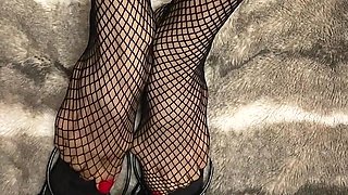 Fishnet in Open Toe Shoes with Red Nail Polish