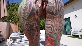 Inked Tigerlilly enjoys an afternoon ride on a big cock
