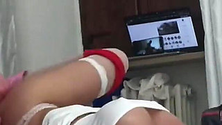 Laura wearing stockings and high heels is bound on the bed, her mouth and pussy fucked