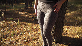 Girl Teases Her Big Cameltoe in Leopard Leggings Outdoors