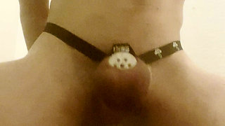 Caged twink tries to cum from anal