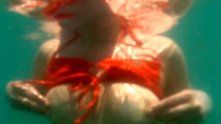 Lovita Fate, sexy angel in bikini by the pool