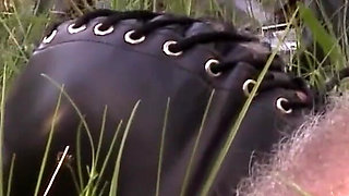 Herrin enslaves man and enjoys foot fetish outdoor