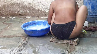 My relative's housewife is taking bath in the open bathroom wearing black underwear at my house
