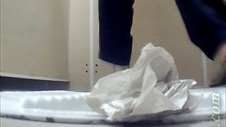 Pale skin booty of a white girl in the toilet room filmed from behind