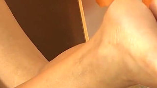 Hot Brunette Gives Footjob to Big Dick!
