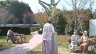 A living nude female Japanese garden statue