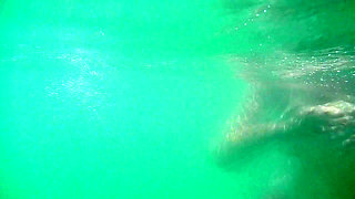 My tits underwater on public beach