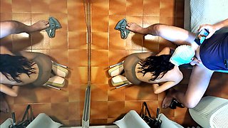 Naked milf in pantyhose and heels gives a blowjob while sipping a drink